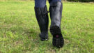 Muck Boot Chore Adjustable Boots showing the model walking and close up of footbed
