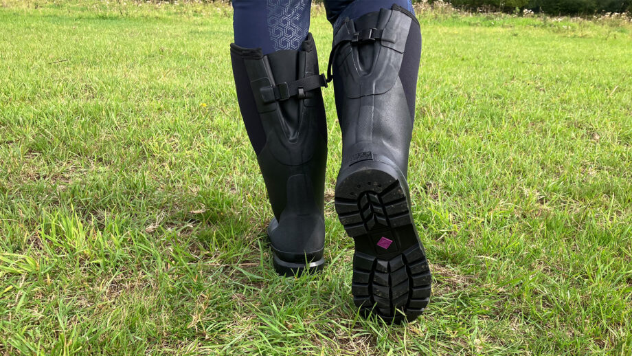 Muck Boot Chore Adjustable Boots showing the model walking and close up of footbed