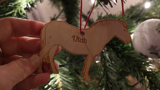 Close up of wooden horse Christmas decoration on Christmas tree