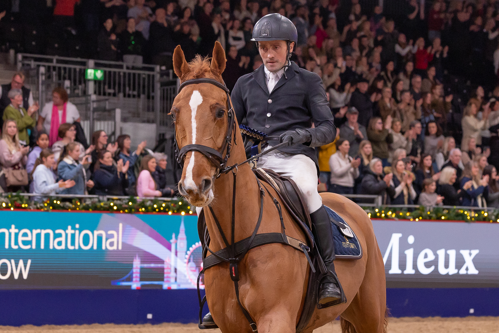 Andrew Hodgins and Shanaclough Luichew after finishing third in the puissance at the London International.