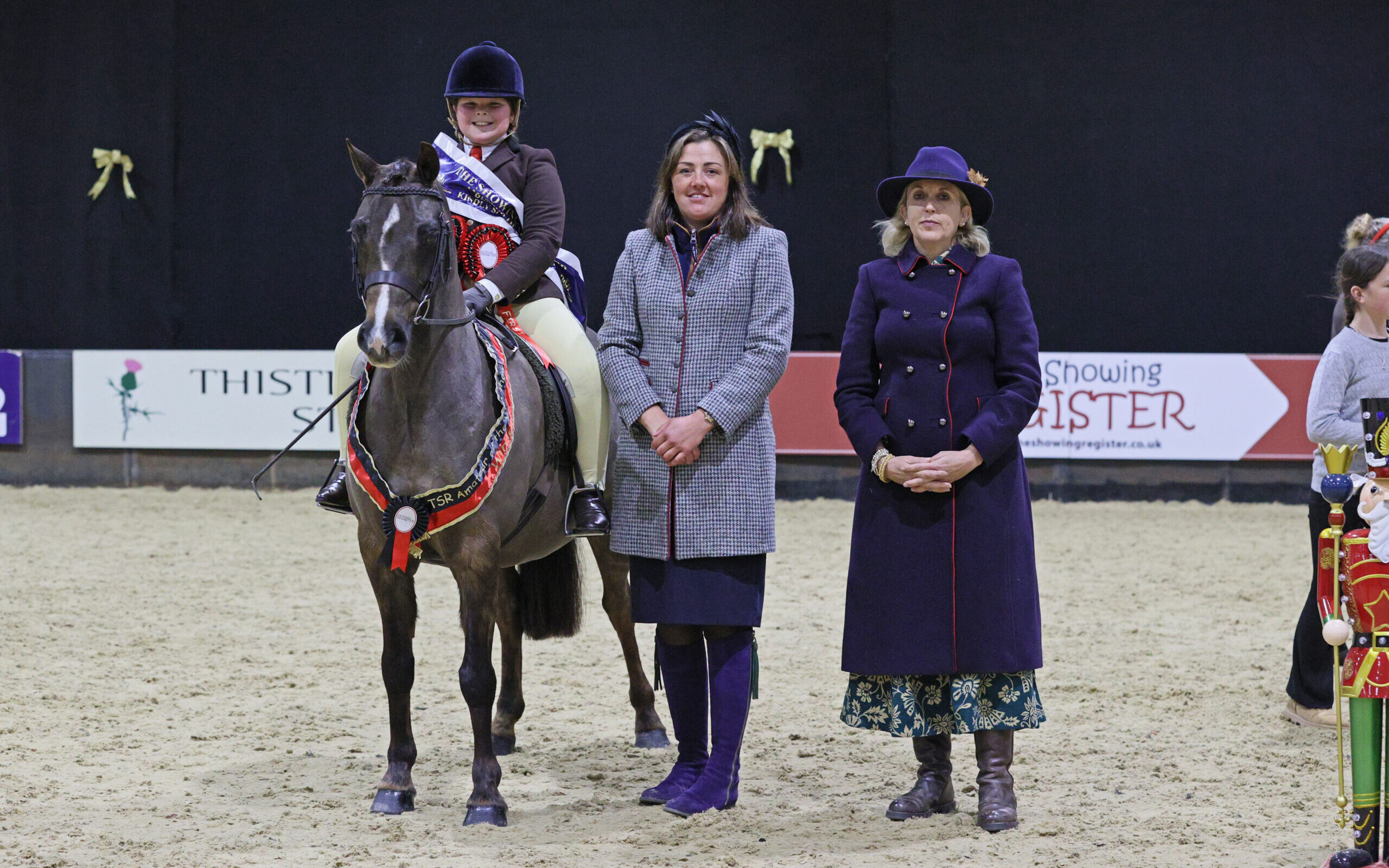 Annandale Toy Soldier and Georgia Canton-Davies win the plaited lead rein class and stand for a photo with judges Michaela Bowling and Lizzie Briant at the TSR Amateur of the Year championships