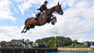 Michael Jung jumping the water in the King George V Gold Cup at Royal International Horse Show