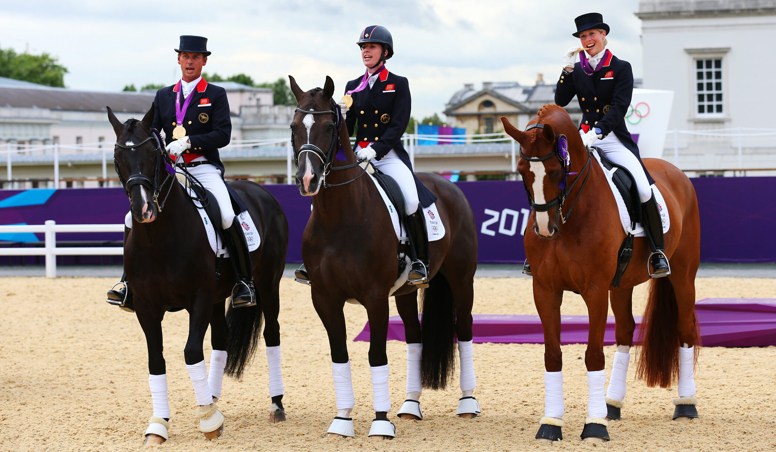 Carl Hester riding Uthopia, Charlotte Dujardin on Valegro and Laura Tomlison on Mistral Hojris celebrating with gold medals at London 2012