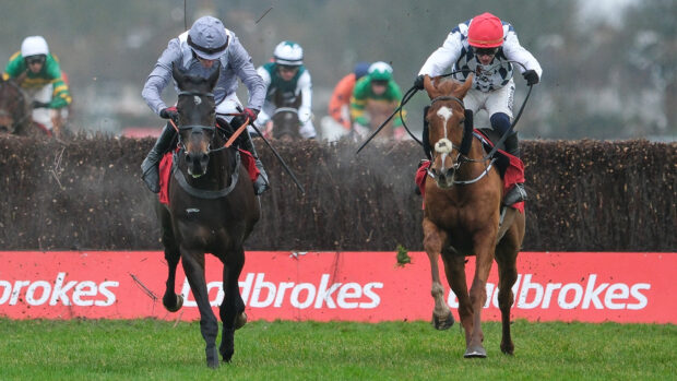 Paul Townend riding Banbridge and from James Reveley riding Il Est Francais clear the last in The Ladbrokes King George VI Chase at Kempton Park