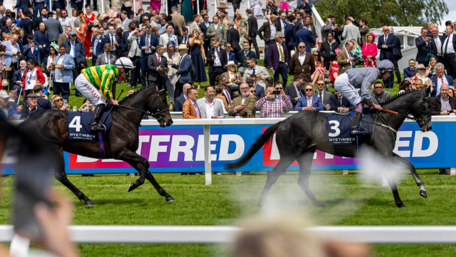 Hollie Doyle on The Waco Kid and Tom Marquand at The Betfred Derby Festival, with the crowd in the background