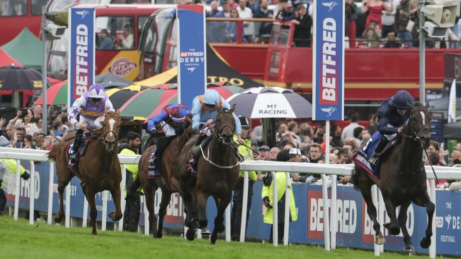 Image shows the action at the 2025 Derby. Winner Lambourn leads the field home in front of the crowds.