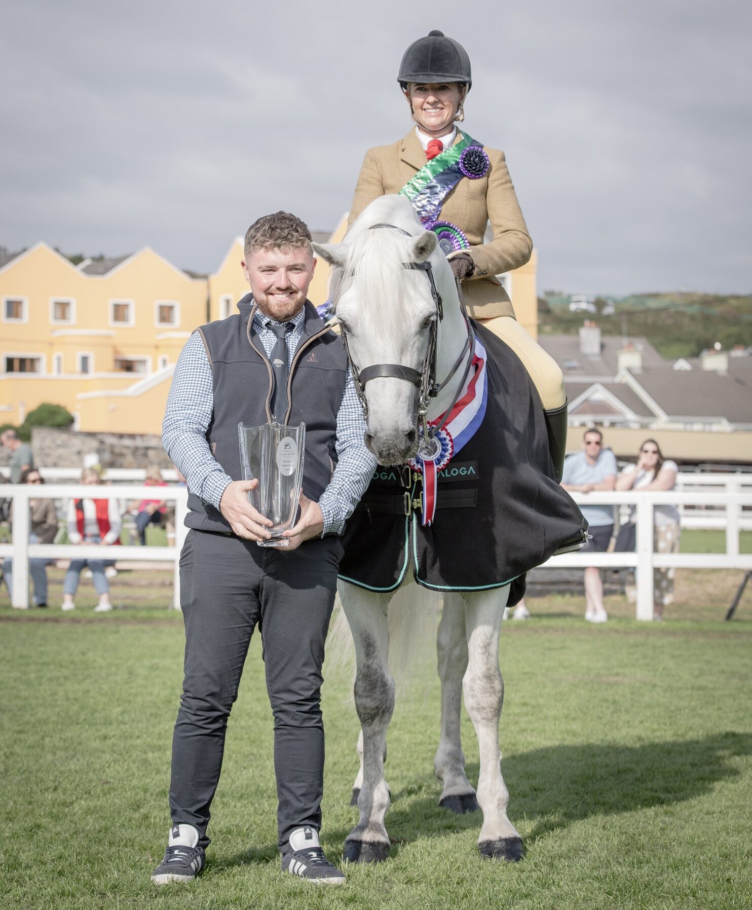 Glencarrig Douvan stands with Patrick Curran, his owner and breeder, and with Grace Maxwell-Murphy in the saddle at Clifden