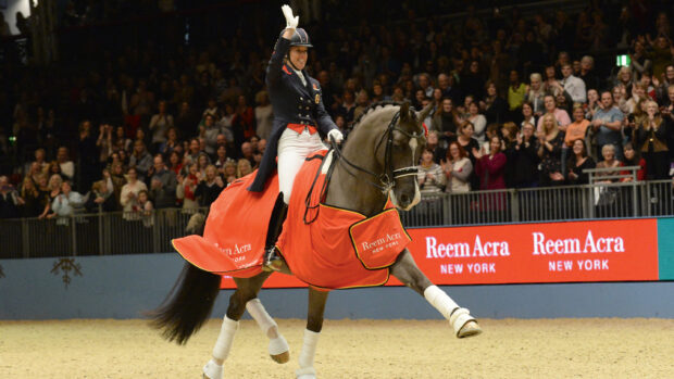 Charlotte Dujardin celebrates after breaking the world record on Valegro at Olympia in 2014