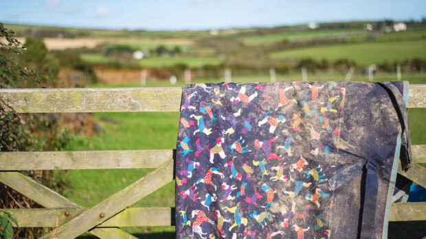Horse rug hanging on a gate