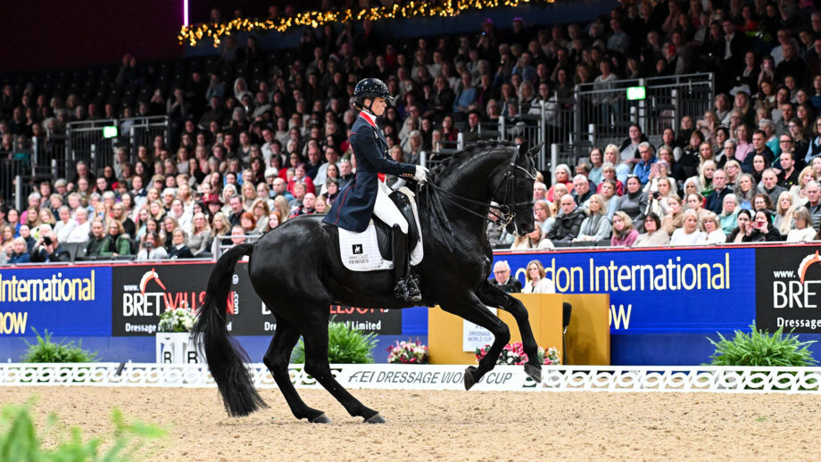 Charlotte Fry rides a canter pirouette on Glamourdale in front of the packed stands at London International Horse Show 2024.