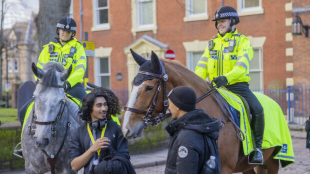 Pictured two West Midlands police horses and officers with two members of the public.