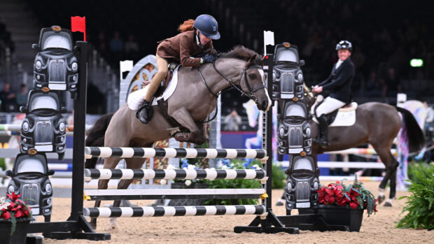 Lilly McBride riding in the mini-major relay at London International Horse Show