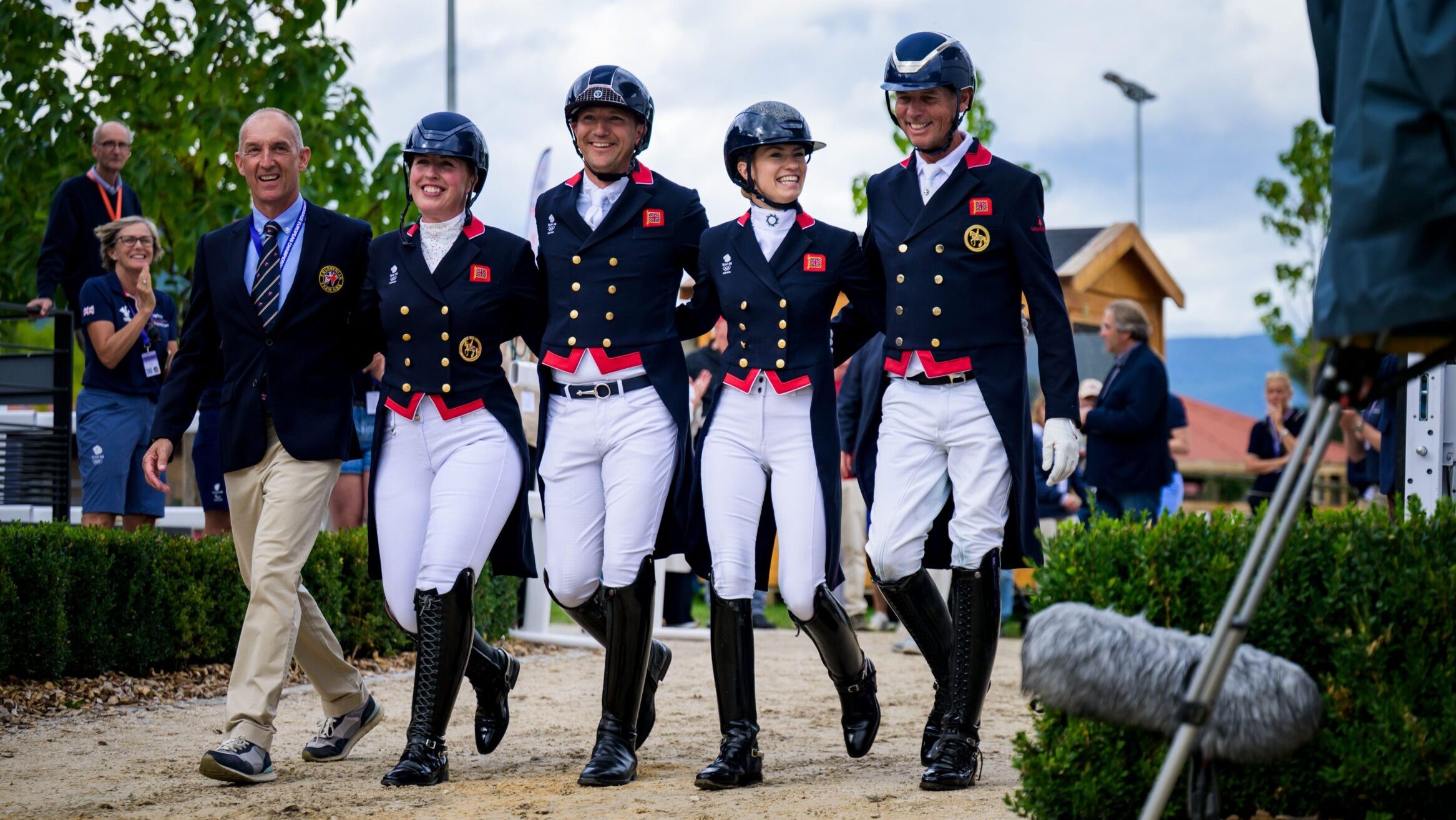 The British team walking arm-in-arm at the 2025 European Dressage Championships