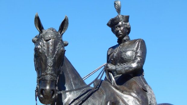 Image shows a sculpture of The late Queen riding Burmese