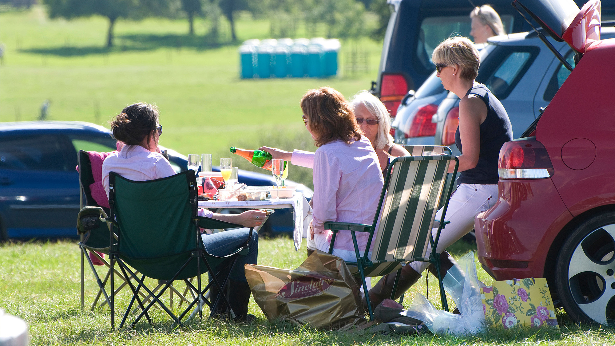Spectators having a picnic in the car park at horse trials