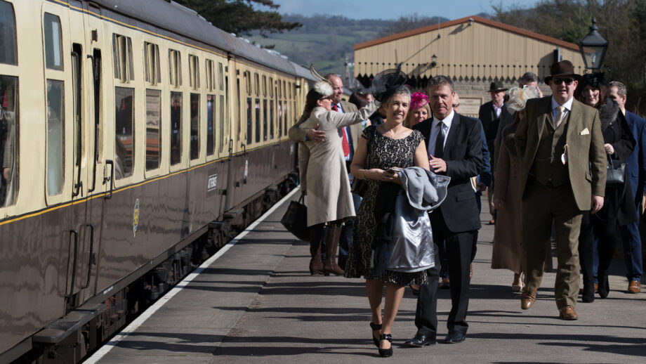 Racegoers arriving at Cheltenham racecourse on steam train platform