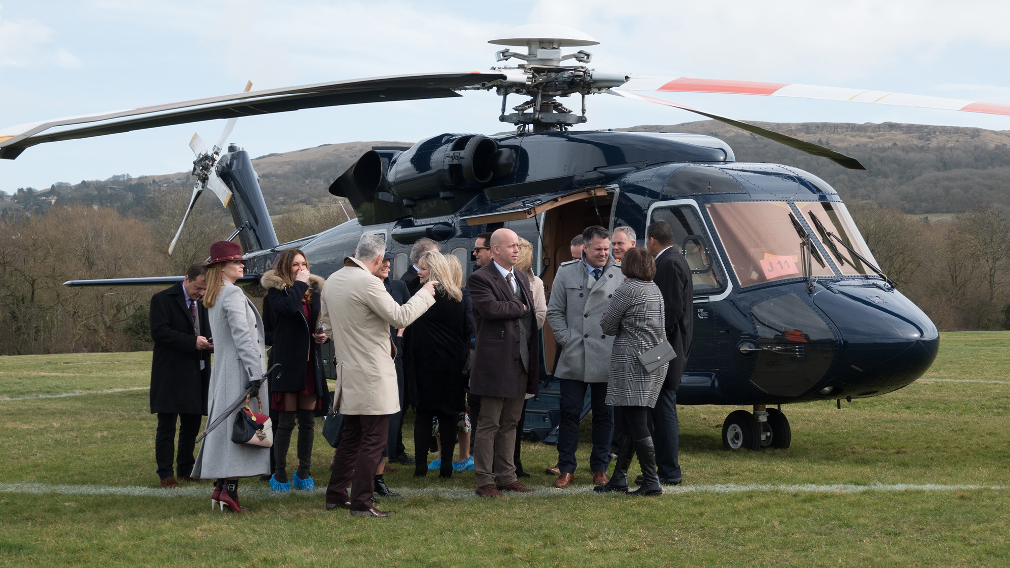 Racegoers arriving at Cheltenham racecourse by helicopter