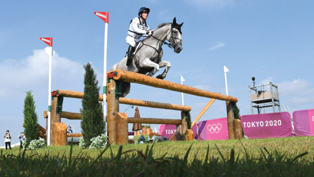 Oliver Townend and Ballaghmor Class clear a large open oxer on the cross-country course at the Tokyo 2020 Olympics