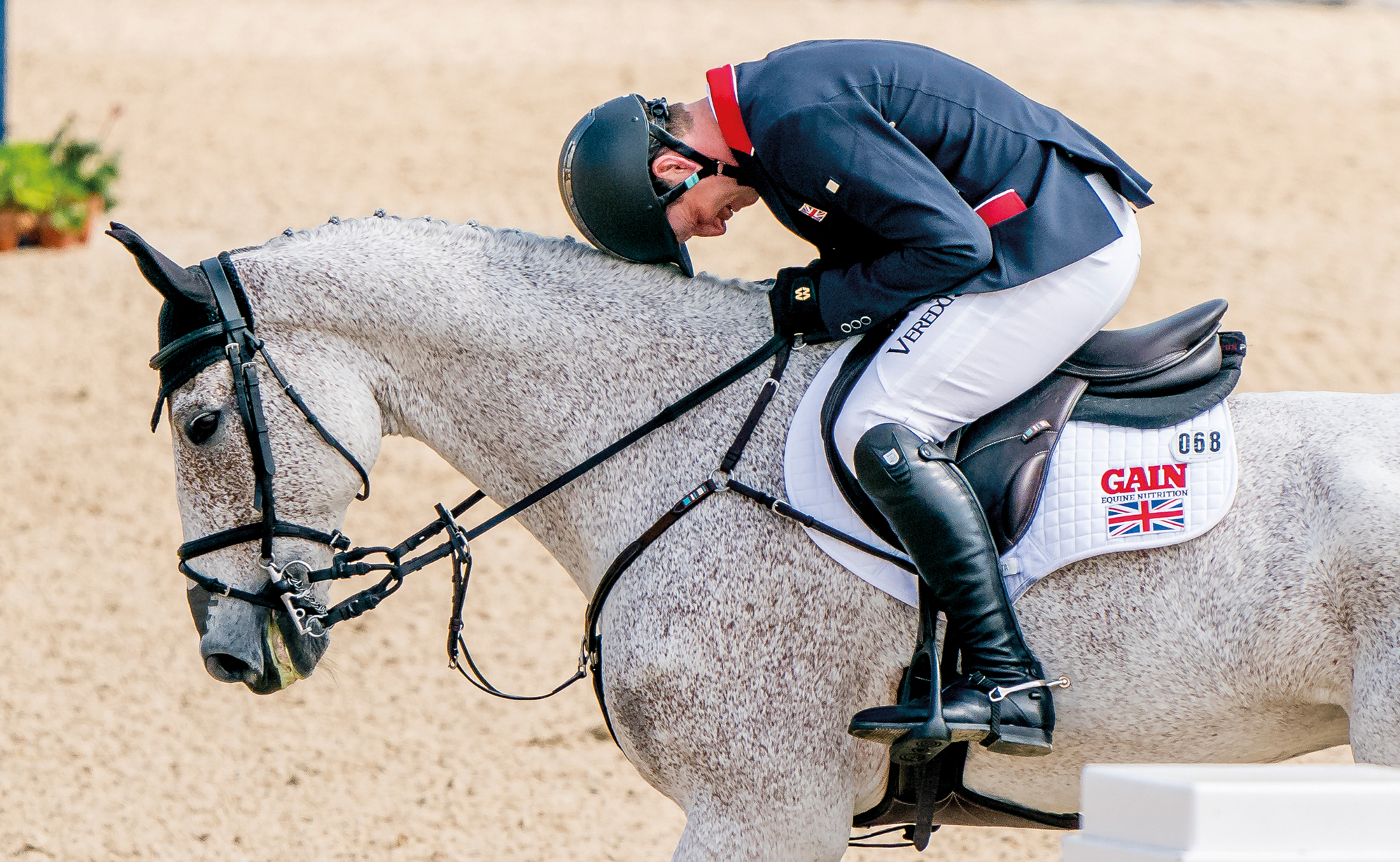 Oliver Townend rests his head on Ballaghmor Class's neck after showjumping clear at Kentucky 2021