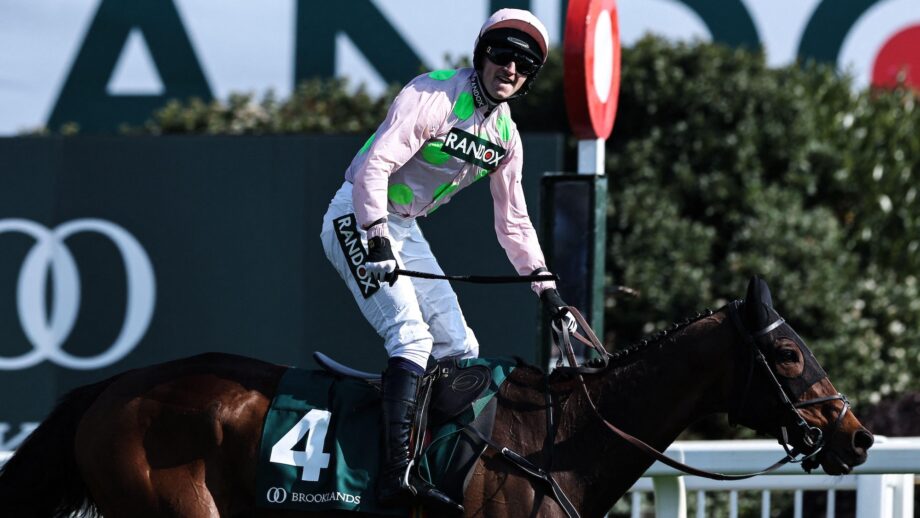 Patrick Mullins celebrates winning at the Aintree winning post on racehorse Gaelic Warrior