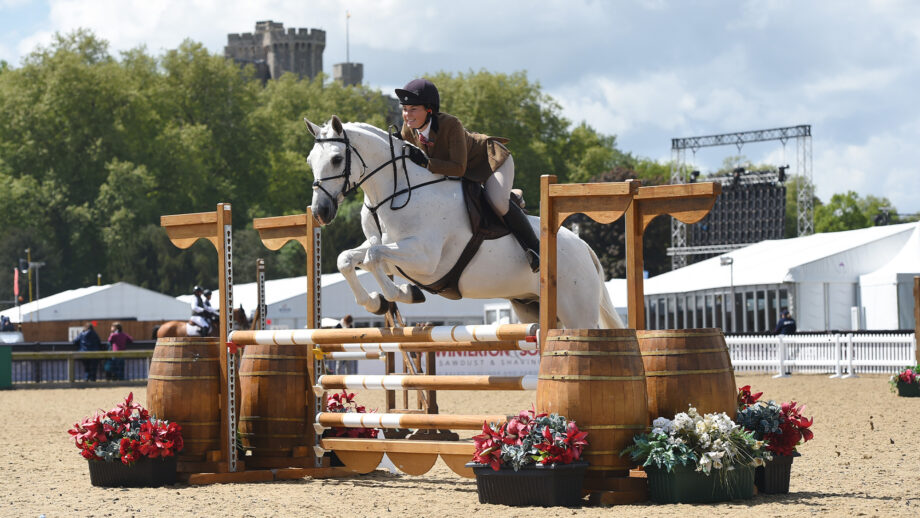 Georgina Horsley-Gubbins riding Ellas Melody during the Working Hunter Pony Championship at the Royal Windsor Horse Show