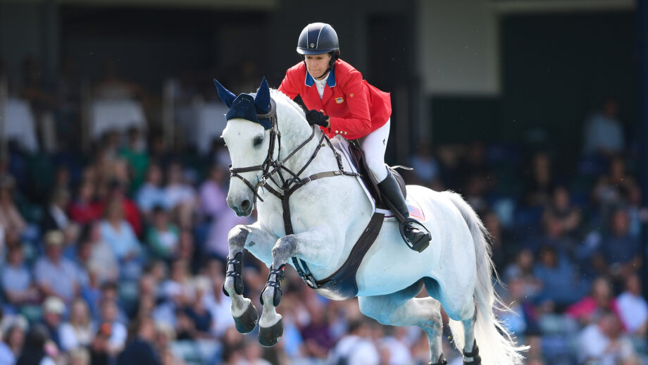 Laura Kraut of USA and Confu clear the water jump during the Longines BHS King George V Gold Cup at Hickstead.