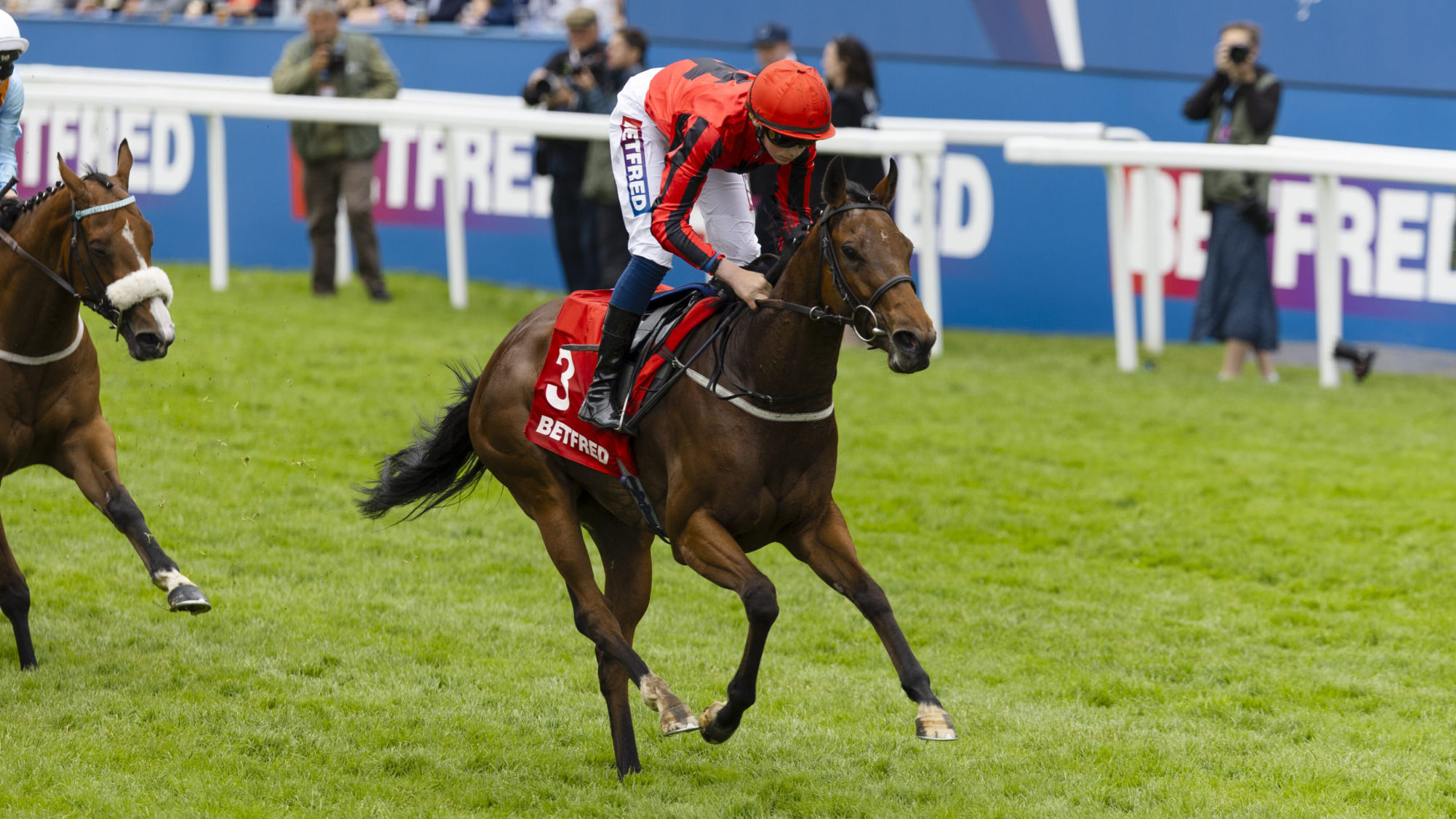 Warren Fentiman on Stormy Impact leads the Betfred 3YO 'Dash' Handicap Stakes during Derby Day at The Betfred Derby Festival 2025