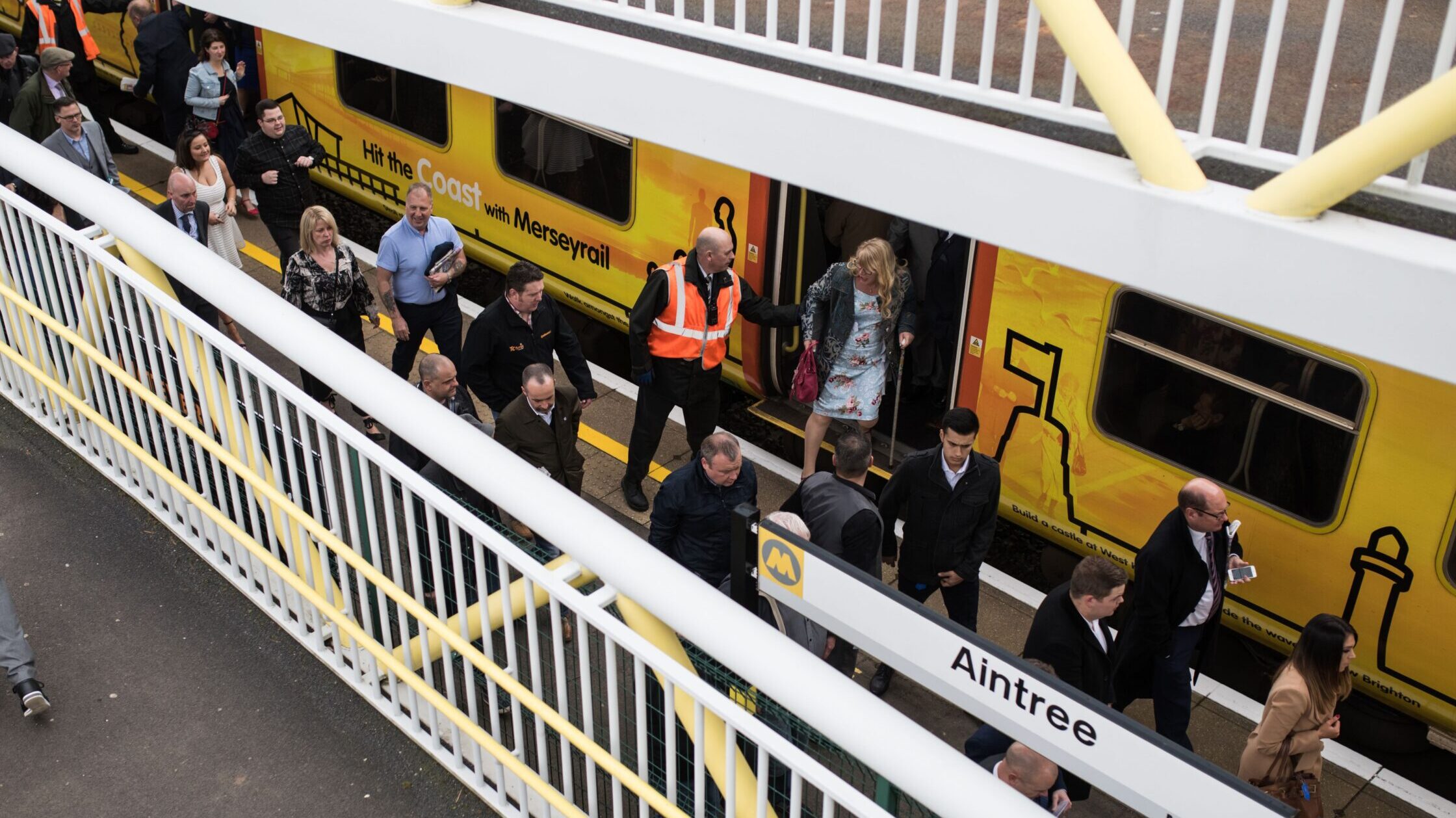 Racegoers arriving at Aintree train station