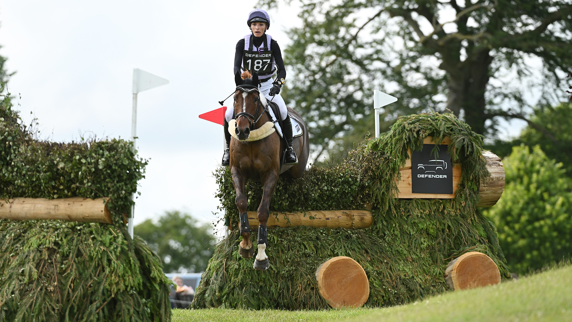Emily King and Jackpot jumping a cross-country fence on the CCI4*-S level eventing cross-country course at Bramham