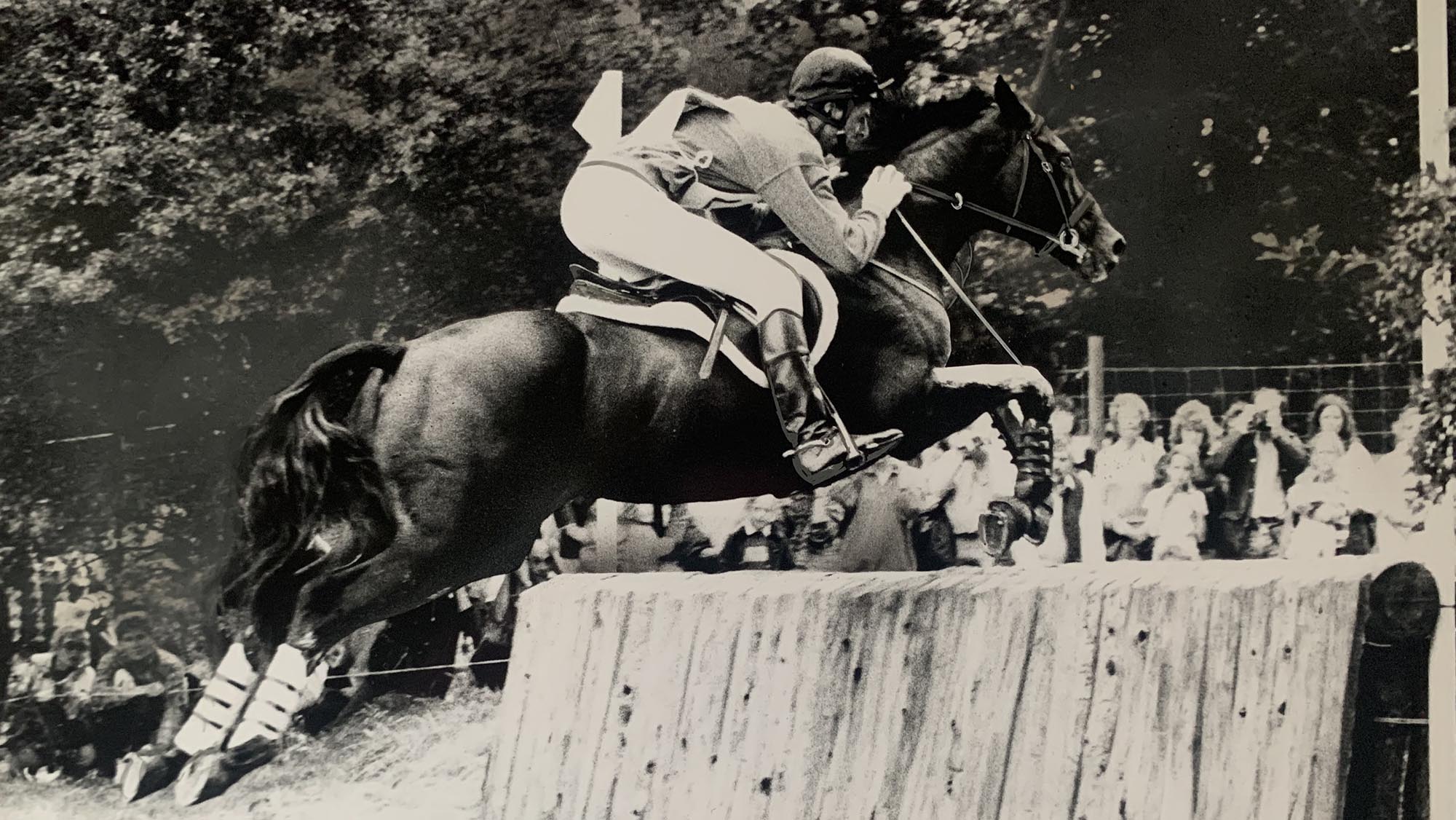Mark Todd and Charisma jumping a cross-country fence on the way to to second at Burghley 1987. 