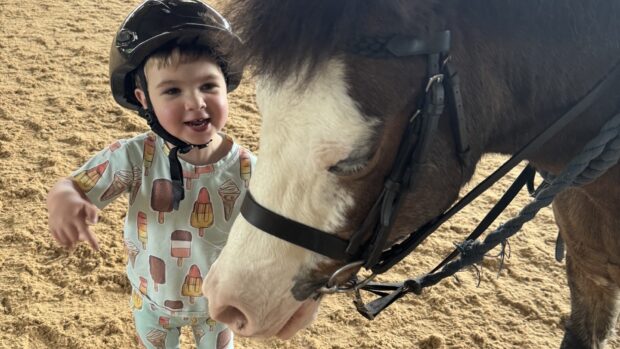 Oliver Christie, pictured with a pony