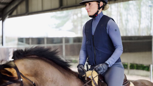 Lady riding horse wearing Racesafe VeloAir air jacket