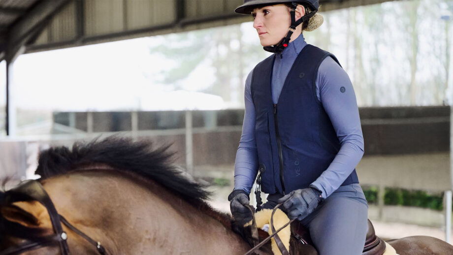 Lady riding horse wearing Racesafe VeloAir air jacket