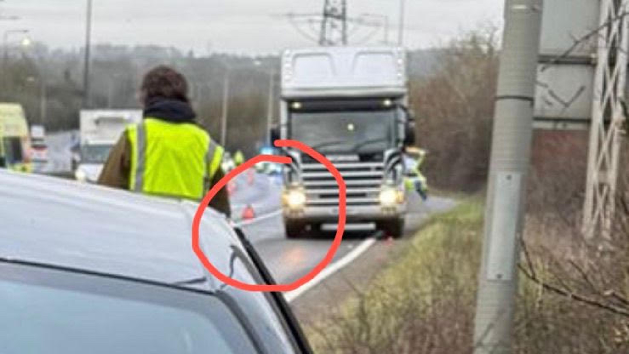 The safety equipment guiding traffic around the lorry