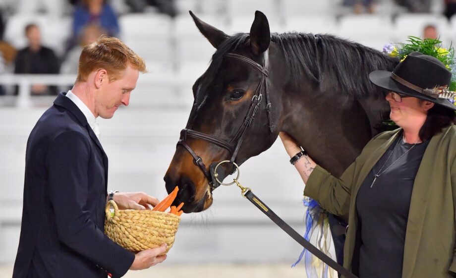 Legacy enjoys carrots during her retirement creemony
