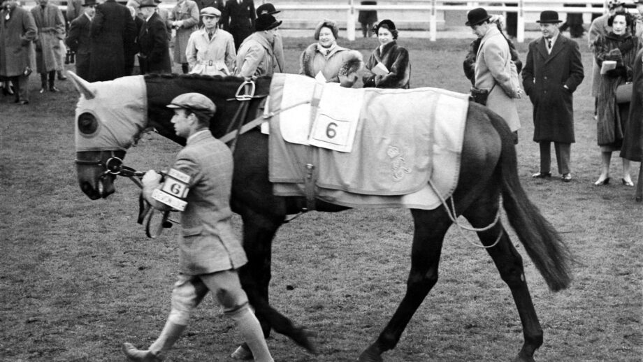 The Queen and Princess Elizabeth watching the Queen's horse Devon Loch paraded in the paddock at Hurst Park racecourse January 1952