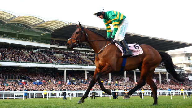 Mark Walsh riding Inothewayurthinkin celebrates winning the Boodles Cheltenham Gold Cup Chase at Cheltenham Festival