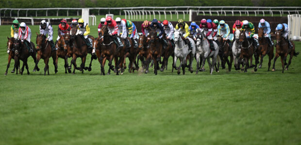 I Am Maximus takes the inside route on his way to victory in the 2024 Randox Grand National at Aintree.