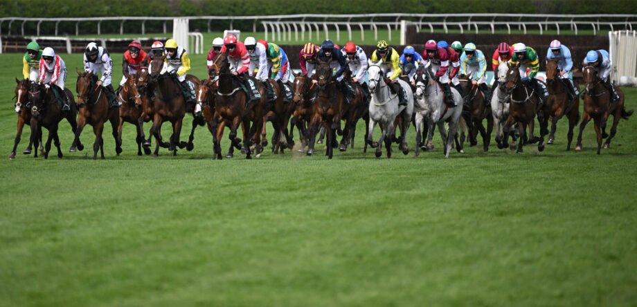 I Am Maximus takes the inside route on his way to victory in the 2024 Randox Grand National at Aintree.