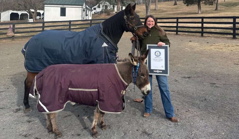 Paige holding Fancy and Rosie with Fancy's certificate