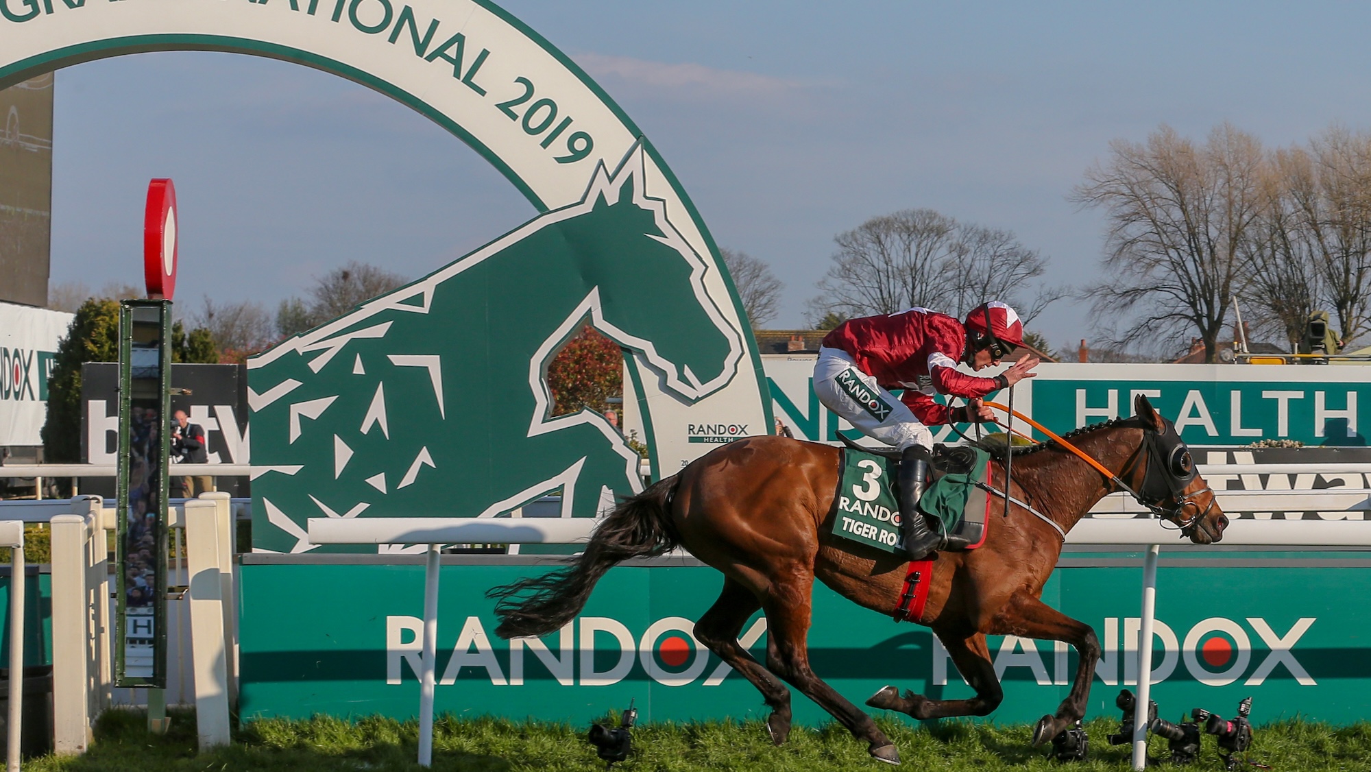 Tiger Roll wins the 2019 Grand National, going past the winning post.