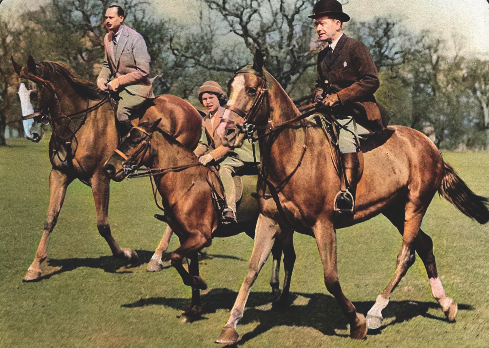 A breezy snapshot taken at Windsor Great Park of Princess Elizabeth (Queen Elizabeth II) riding with her uncle the Duke of Gloucester (left) and Mr Owen, riding master at Windsor Castle.