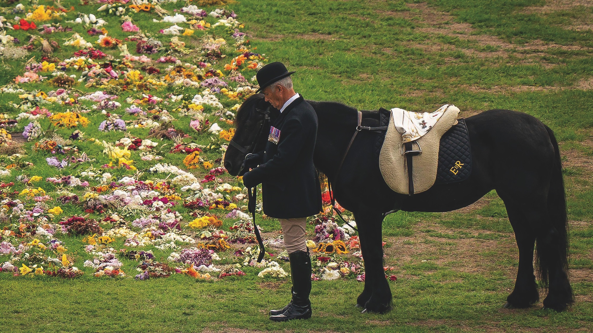 Emma, the monarch's fell pony, stands as the Ceremonial Procession of the coffin of Queen Elizabeth II arrives at Windsor Castle for the Committal Service at St George's Chapel, England, Monday, Sept. 19, 2022, three and a half years before the Queen's 100th birthday.