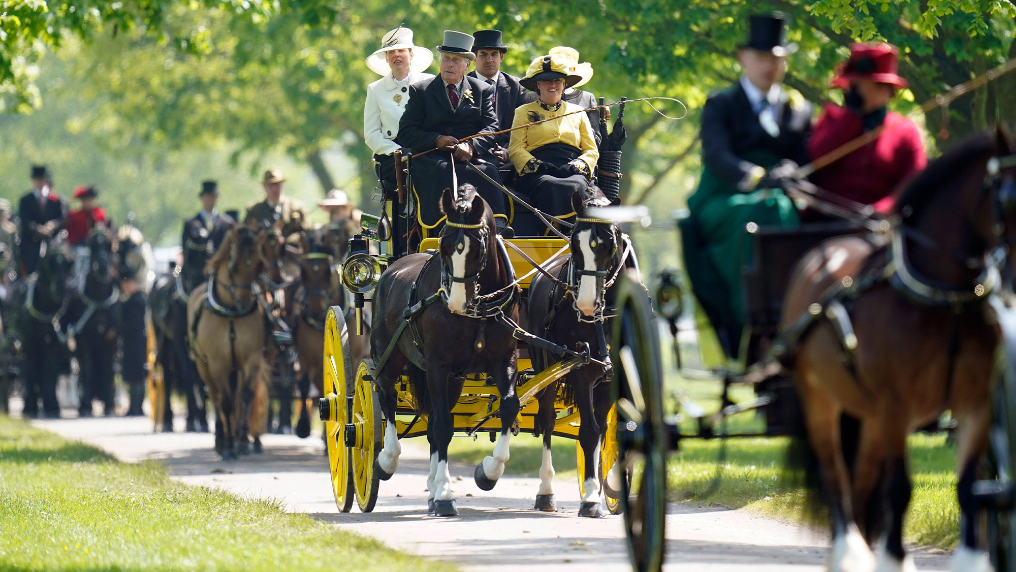 Carriages are driven out of the castle grounds during the Pol Roger Meet of the British Driving Society at the Royal Windsor Horse Show