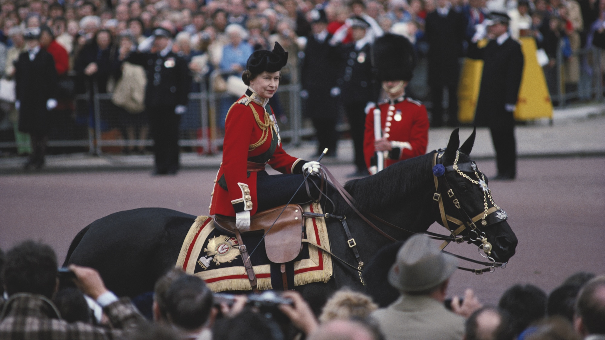 Queen Elizabeth II riding a horse, in ceremonial dress, during the Trooping the Colour ceremony on Horse Guards Parade, London, England, Great Britain, June 1979. The Queen is riding 'Burmese', a gift from the Canadian Royal Mounted Police. (
