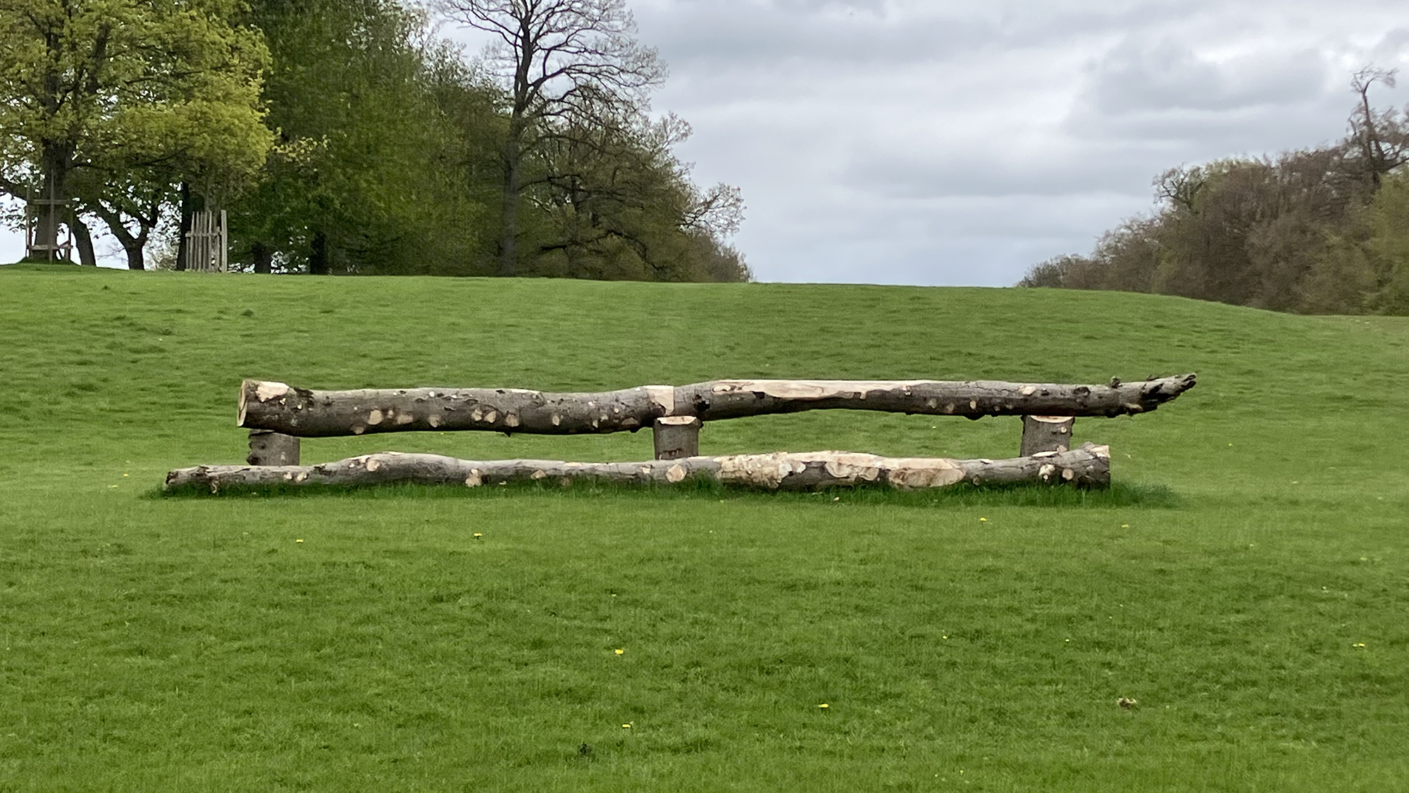 A hanging log jump set on rising ground in the Badminton Estate