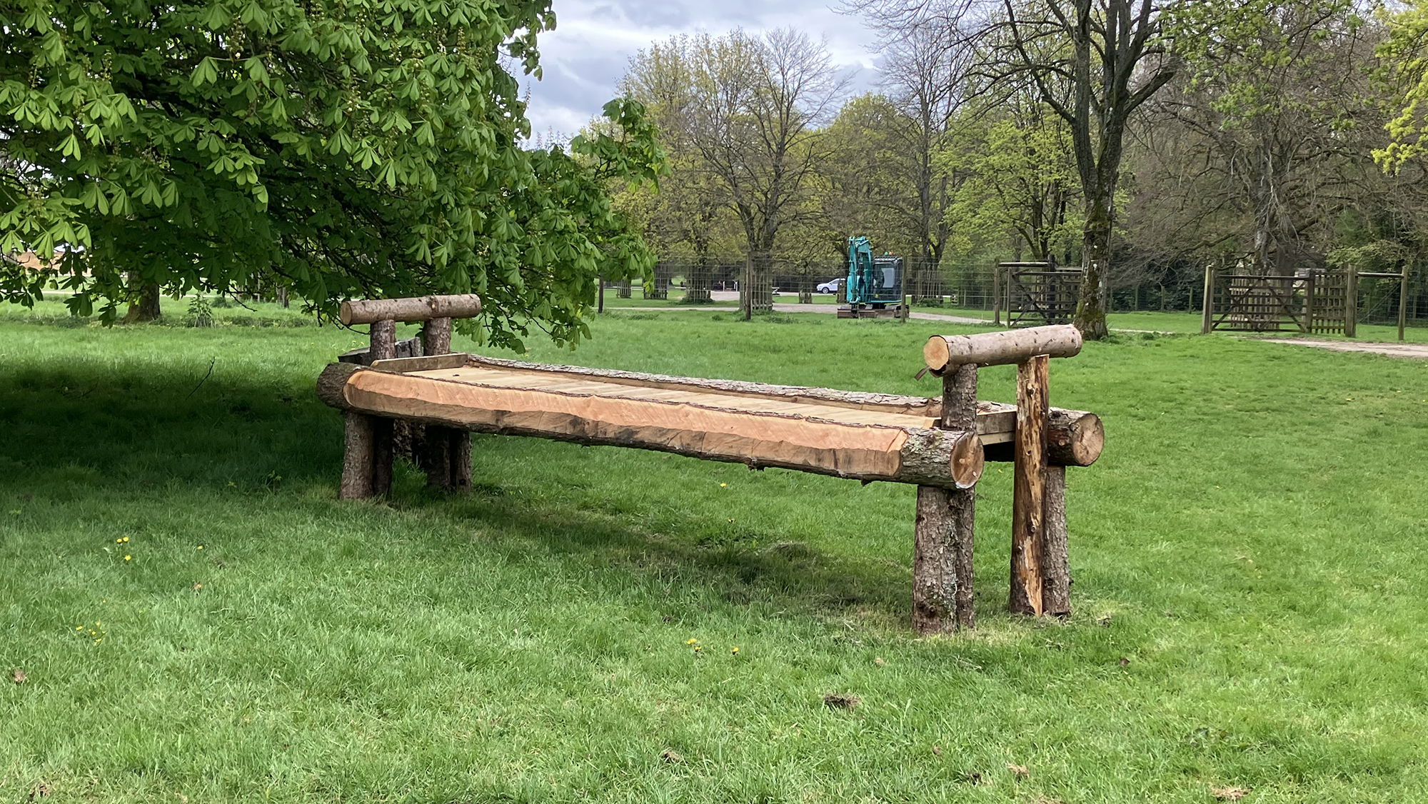 A wooden table beside a tree at fence three on the Badminton grassroots cross-country course