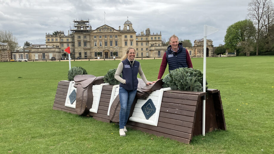 Event rider Kitty King and Badminton grassroots course designer James Willis by the saddle fence with Badminton House in the background