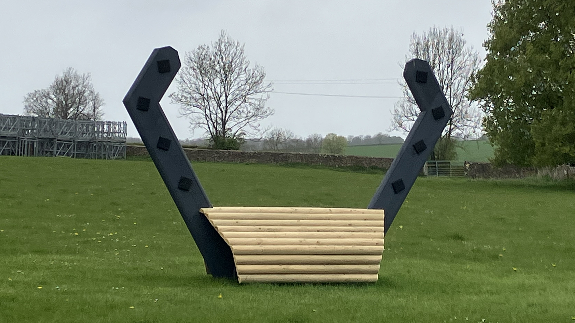 A horseshoe shaped cross-country jump in the Badminton parkland