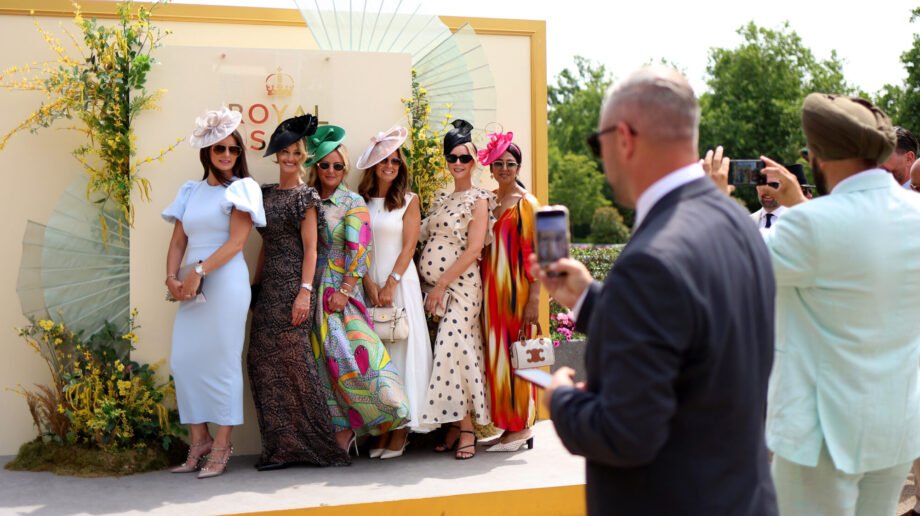 Ladies dressed up and having their photo taken at Royal Ascot